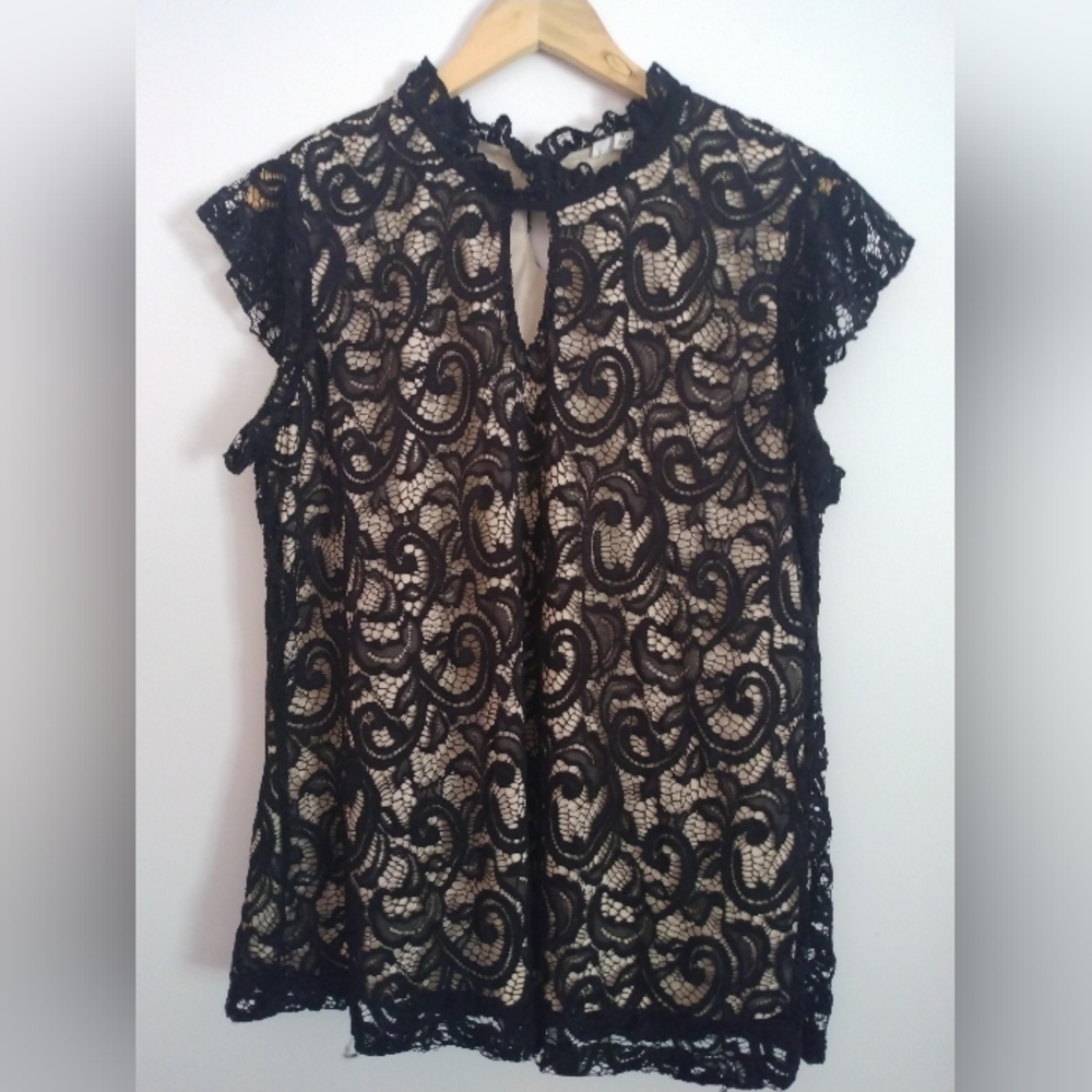 Back and Creme blouse